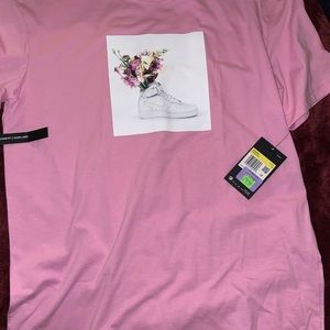 Pink Nike women’s Loose fit shirt.
